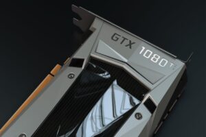 High-end graphics card inside a modern gaming PC setup with a 1440p monitor displaying a detailed game scene — ideal hardware for 1440p gaming in 2025.