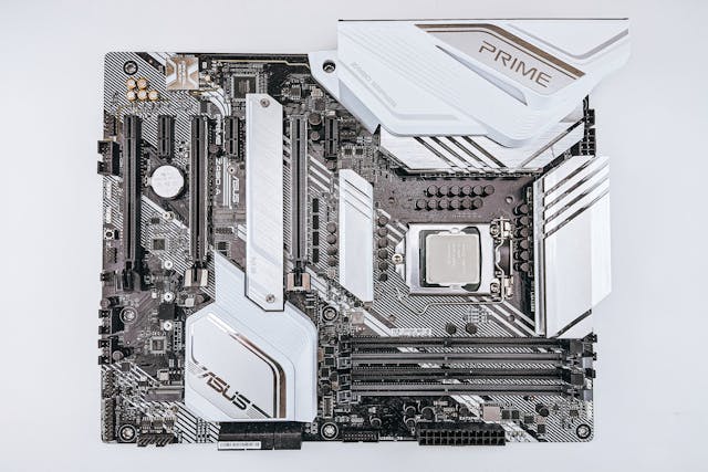Gaming PC motherboard with CPU socket, RAM slots, and PCIe slots visible.