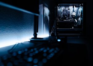 Top 6 cheap gaming PCs of 2025 displayed on a gaming desk.